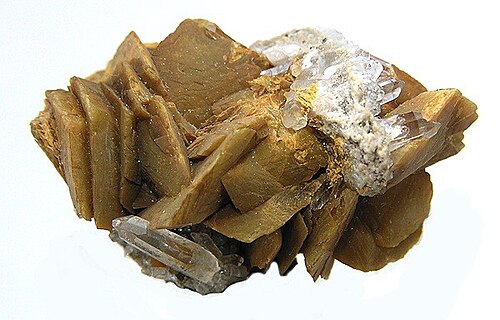 コロラド産菱鉄鉱、オリーブブラウンの鋭い刃状結晶と少量の石英がアクセントとして混ざっている