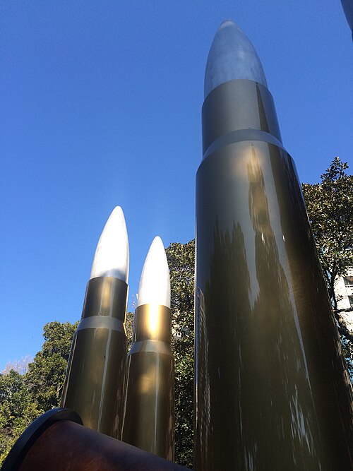 Three of the artwork's four standing bullets