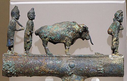 Dian people with an ox