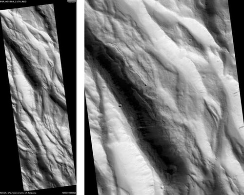 HiRISE が撮影したアケロン フォッサ。スケール バーの長さは 1000 メートルです。画像をクリックすると、暗い斜面の筋が見えます。