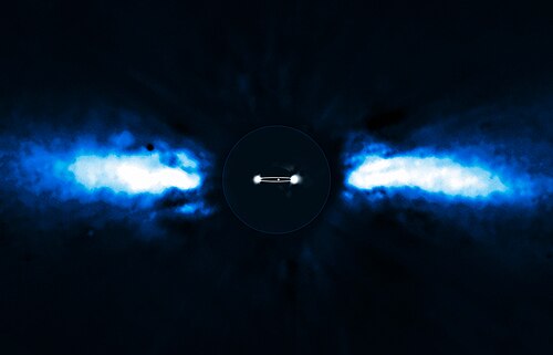 がか座ベータ星の周囲にある 2 つの太陽系外惑星を直接撮影したもの。星を減算し、惑星の 1 つの軌道の輪郭を人工的に装飾しています。中央の白い点は、同じ系にあるもう 1 つの太陽系外惑星です。