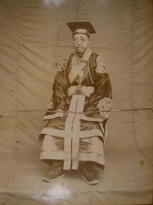 Official wearing sacrificial clothing.