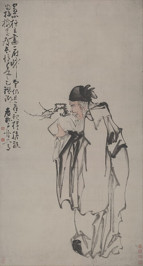 梅の花を持つ