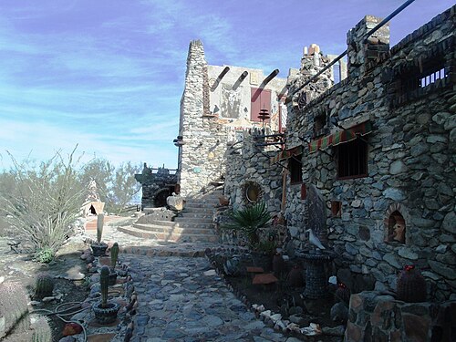Mystery Castle is located at 800 E. Mineral Road, in the city of Phoenix, in the foothills of South Mountain Park. It was built in the 1930s by Boyce Luther Gulley. The castle is designated as a Phoenix Point of Pride.