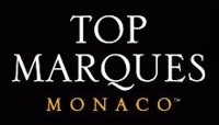 トップ マルケス モナコのロゴ。イベント名は大文字のセリフ体で、文字は黒地に白、文字は金色で「Monaco」が小さく表示されます。