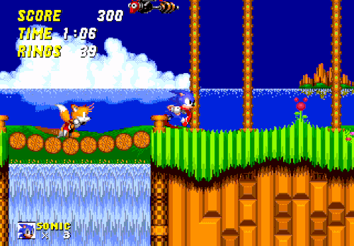 Sonic and Tails run around a loop and a corkscrew, and collect rings in the first level of Sonic the Hedgehog 2, a grassy area called Emerald Hill.